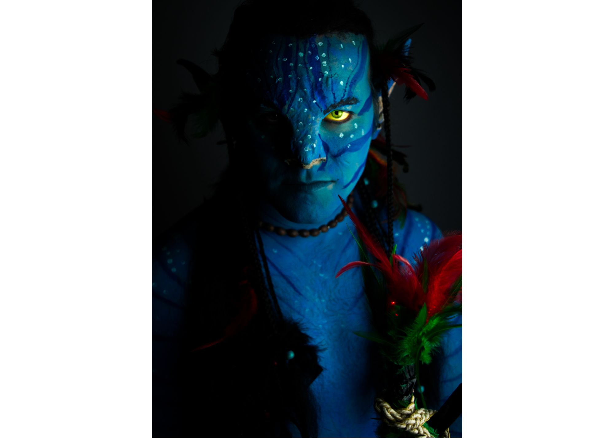 A person dressed as a Na'vi humanoid from Avatar. 